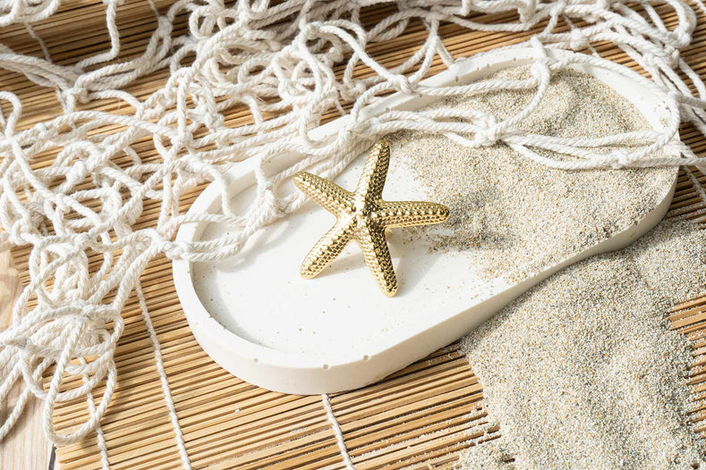 Anillo estrella de mar de acero dorado