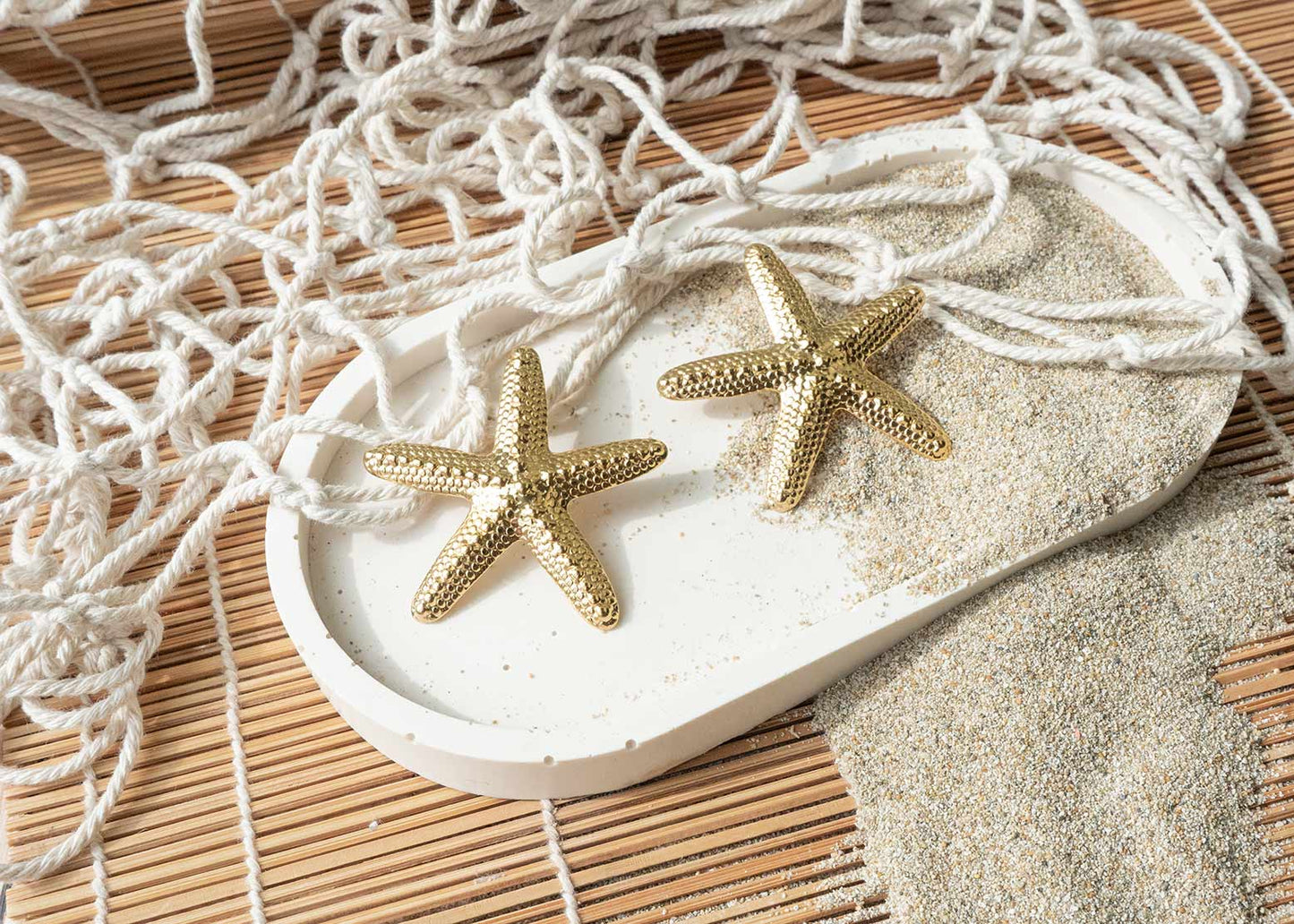Pendientes maxi estrella de mar de acero dorado
