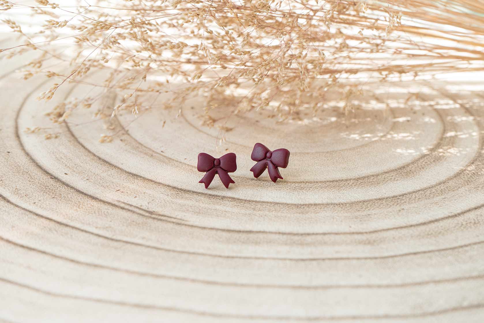 Pendientes lazos pequeños burdeos