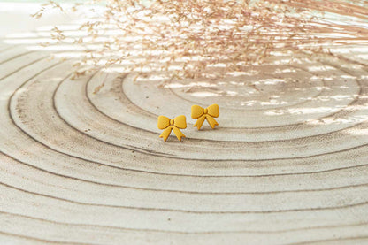 Pendientes lazos pequeños mostaza