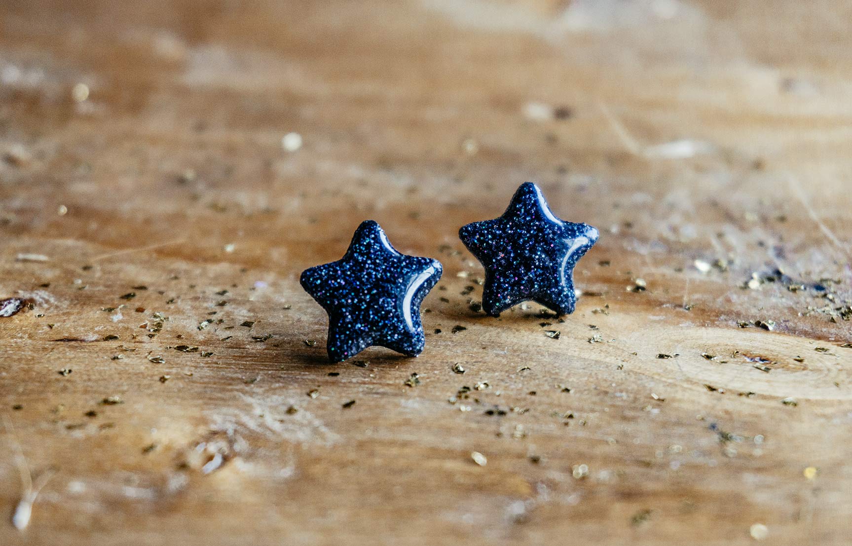 Pendientes estrellas negras purpurina